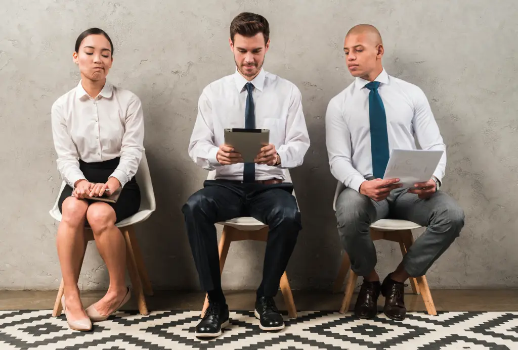 jealous-businesswoman-sitting-near-businessman-using-digital-tablet